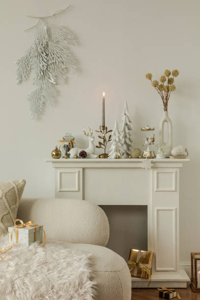 istock Minimalistic Christmas mantel with natural tones and winter decorations. Warm and inviting holiday interior setting. 2185532215