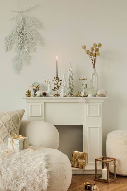 istock Minimalistic Christmas mantel with natural tones and winter decorations. Warm and inviting holiday interior setting. 2185532359