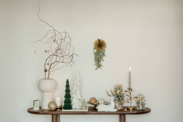 istock Rustic console table with winter decorations, vintage skis, and snowflake ornaments. Perfect for a cozy holiday atmosphere. 2185532415