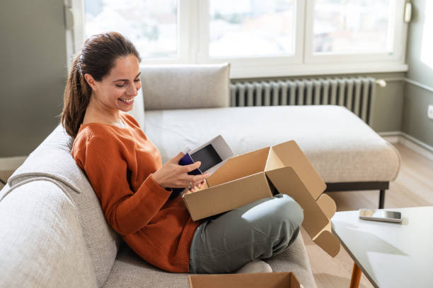 istock Opening surprises: Woman delighted by her online order 2185534074