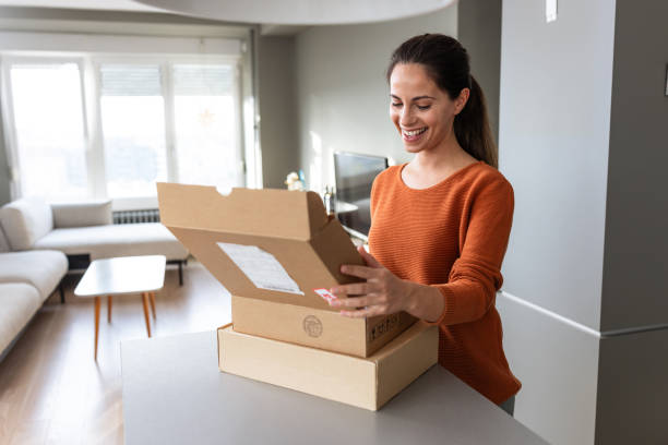 istock Relaxed and happy: Woman receiving her online delivery 2185534078