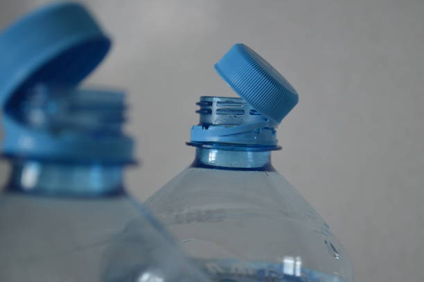 istock Top of Plastic Bottles with open non-removable caps 2185535386