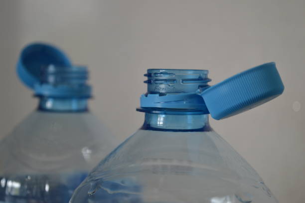 istock Top of Plastic Bottles with open non-removable caps 2185535389