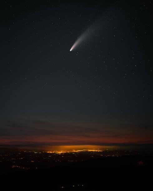 istock A comet lights up the night sky shortly after sunset 2185535629