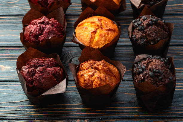 istock Mix of muffins ( cupcake ) chocolate , vanilla , berries . Top view 2185535837