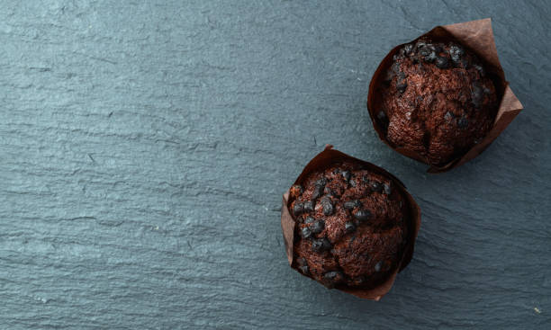 istock Sweet Baked chocolate muffins ( cupcake )  . Top view 2185535855