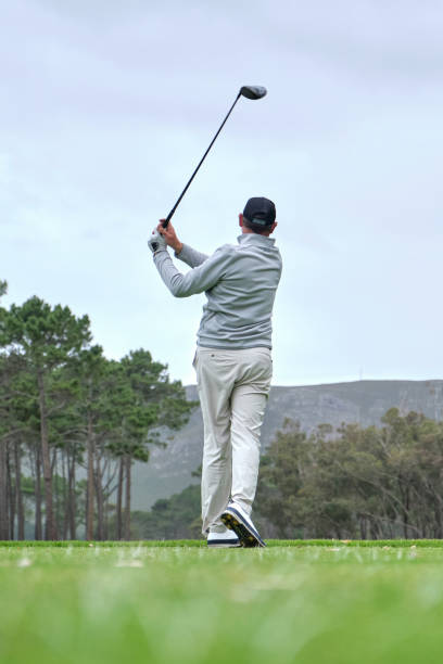 istock Golfer hitting the perfect drive off the tee box down the fairway. 2185537495