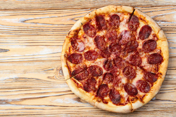 istock Pizza pepperoni fast food . Top view on rustic background 2185537718