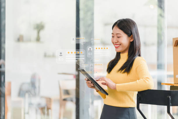 young woman in yellow sweater is smiling while using tablet, surrounded by digital review icons indicating high ratings. This scene captures essence of customer satisfaction and modern technology