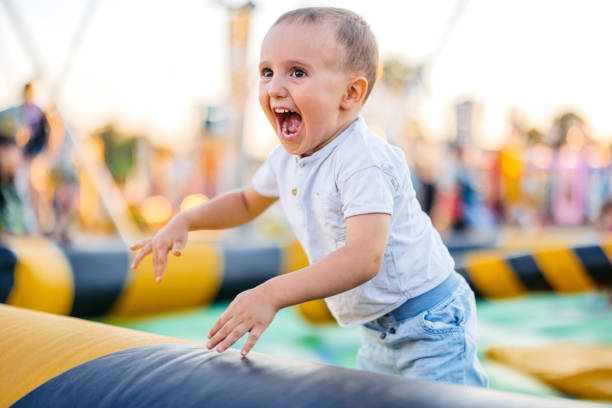 Cute toddler boy enjoying his time in an Amusement park.