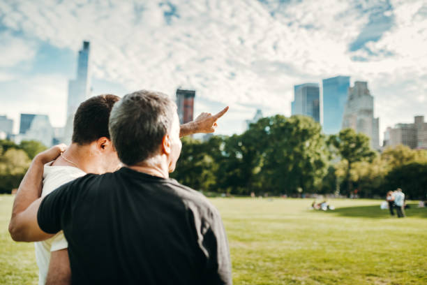 istock gay couple looking ahead thinking to the future 2185538425