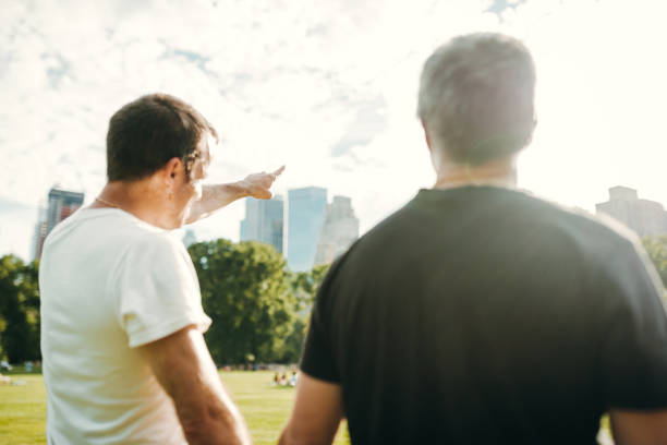 istock gay couple looking ahead thinking to the future 2185538512