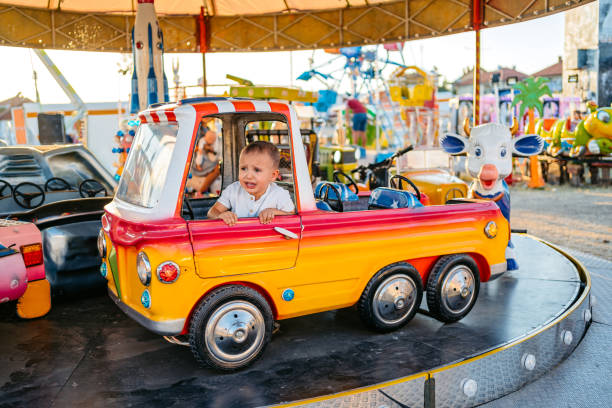 Cute toddler boy crying in an Amusement park.