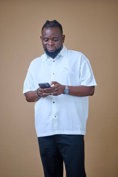 istock African man holding a phone 2185543001