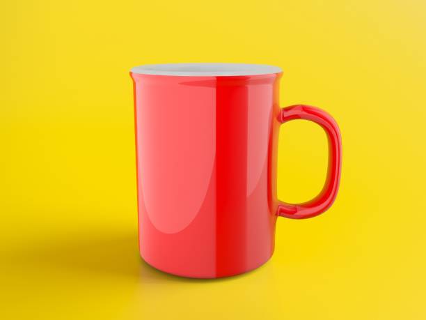 istock Bright red coffee mug on yellow background 2185543116