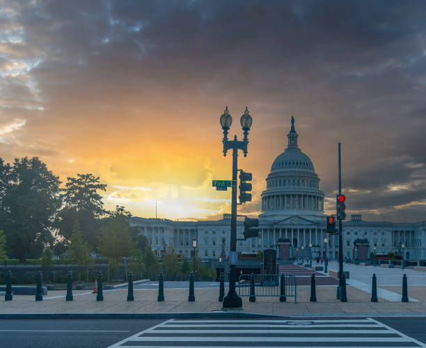 istock United States Capitol Building under a dramatic sky at sunset 2185544107
