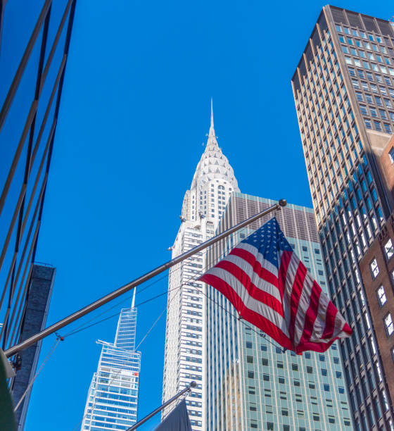 istock Us flag with Manhattan skyscrapers on the background 2185544166