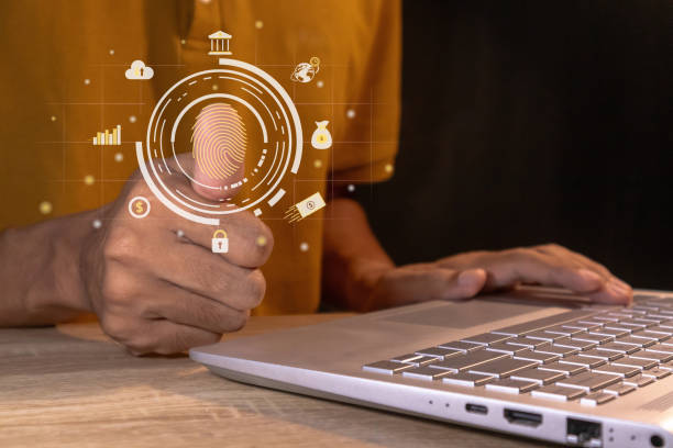 istock Man using thumb to scan fingerprint on virtual screen to access internet banking or security system. 2185545510