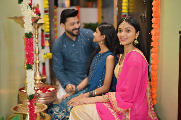 istock Father and his two daughters together decorating the house during Diwali celebration 2185546062