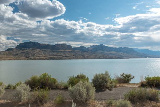 istock Serene Lake with Mountain Background 2185548434