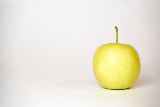 Yellow apple on white background. One apple print set, wall art, fruits