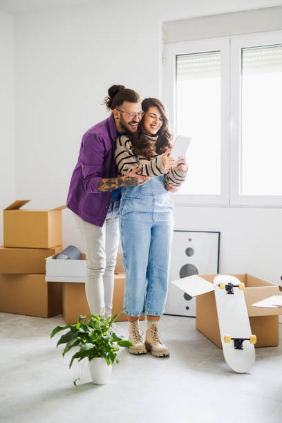 istock Happy couple moving to new home 2185550257