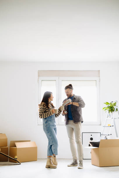 istock Couple drinking first coffee at their new home 2185550422