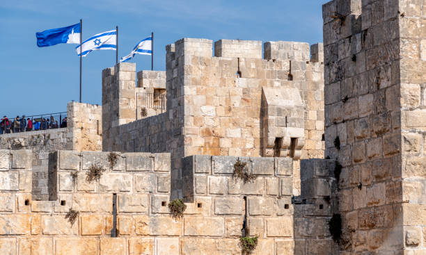 istock Flags flying in the wind at Old Town Jerusalem 2185555277