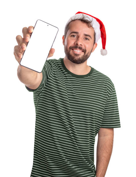 istock Smiling bearded guy wearing Santa hat shows blank cell phone screen 2185555638
