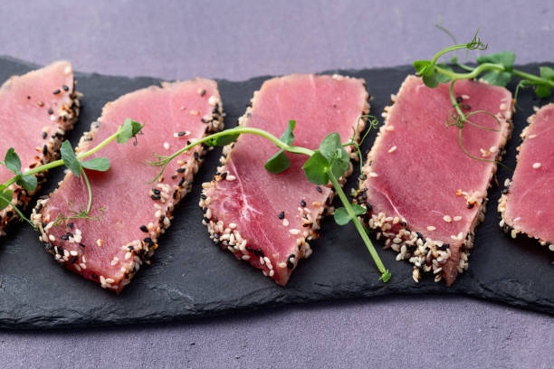 istock Sliced tuna steak with sesame photography . Top view 2185555949
