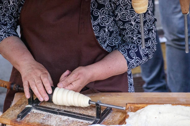 istock .the hands of the bun maker do the cooking 2185561855