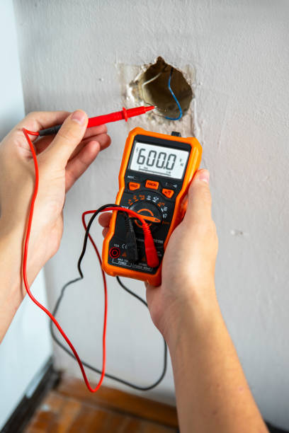 istock Electrician Doing Safety Inspection on Electrical outlet 2185562375