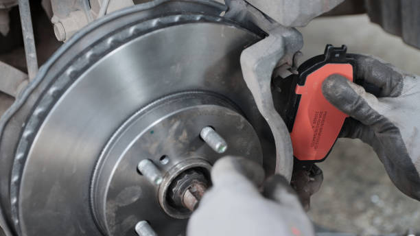 istock Zoom View Brake Pad Replacement by Car or Auto Mechanic 2185565005