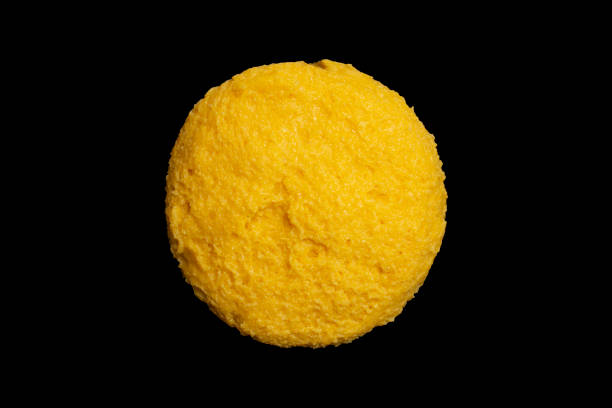 Round polenta also called mamaliga in Romania, traditional food, flat lay close up texture Round polenta also called mamaliga in Romania, traditional food, flat lay close up mamaliga stock pictures, royalty-free photos & images