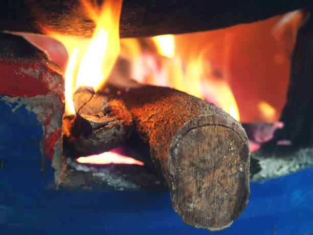 clay firepot and brazire burnning wood with cooking pan