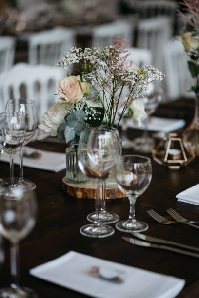 istock Elegant Wedding Table Setting with Delicate Floral Arrangements and Wine Glasses 2185567021