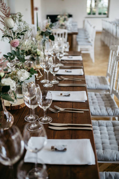 istock Elegant Wedding Table Setting with Wine Glasses and Floral Decorations 2185567055