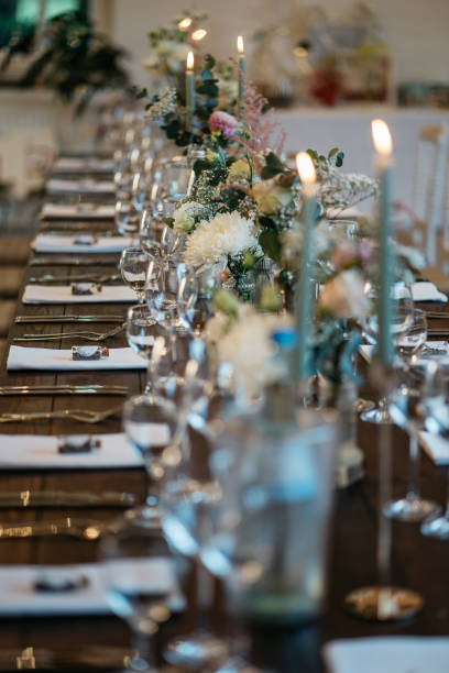 istock Elegant Wedding Table Setting with Delicate Floral Arrangements and Wine Glasses 2185567085