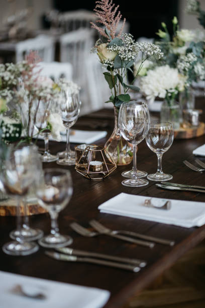 istock Elegant Wedding Table Setting with Delicate Floral Arrangements and Wine Glasses 2185567152