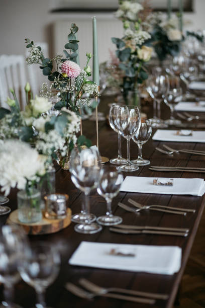 istock Elegant Wedding Table Setting with Delicate Floral Arrangements and Wine Glasses 2185567187