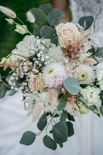 istock Elegant Wedding Table Setting with Delicate Floral Arrangements and Wine Glasses 2185567230