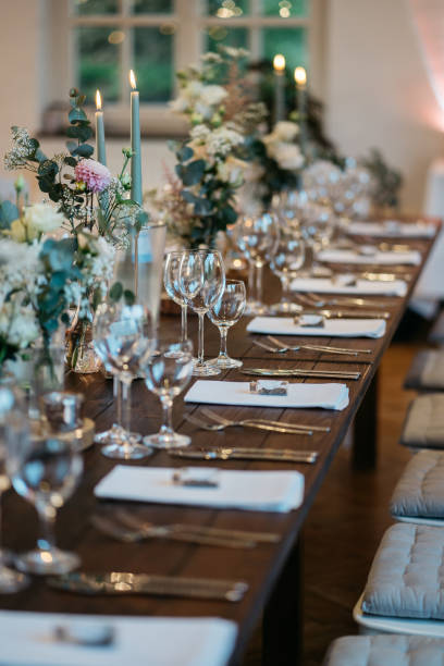istock Elegant Wedding Table Setting with Delicate Floral Arrangements and Wine Glasses 2185567471