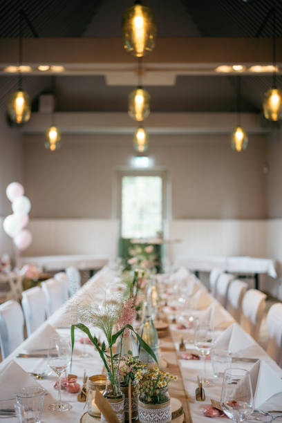 istock Rustic Wedding Table Setting with Vintage Glass Bottles, Wood Slices and napkins 2185567593