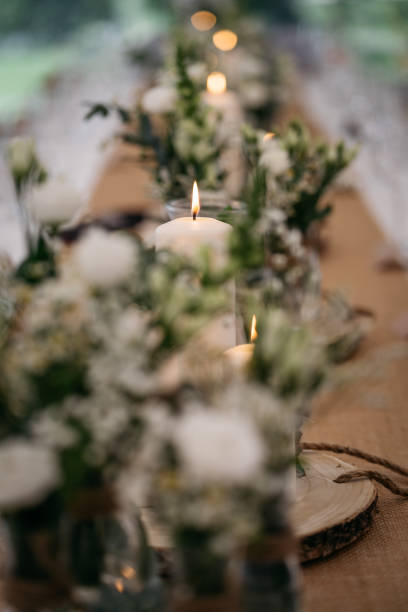 istock Rustic Garden Wedding Table Setting with Floral Centerpieces and Candles 2185568641