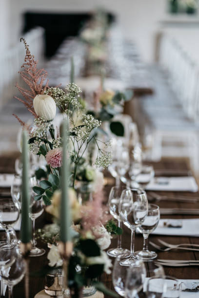 istock Elegant Wedding Table Setting with Delicate Floral Arrangements and Wine Glasses 2185568848