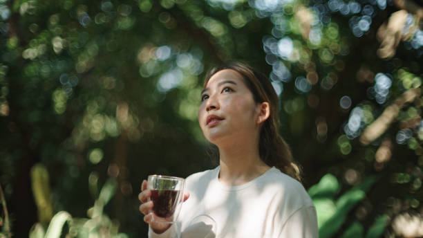 istock Woman drinking coffee at nature. 2185568885