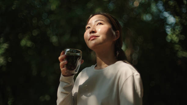 istock Woman drinking coffee at nature. 2185568893