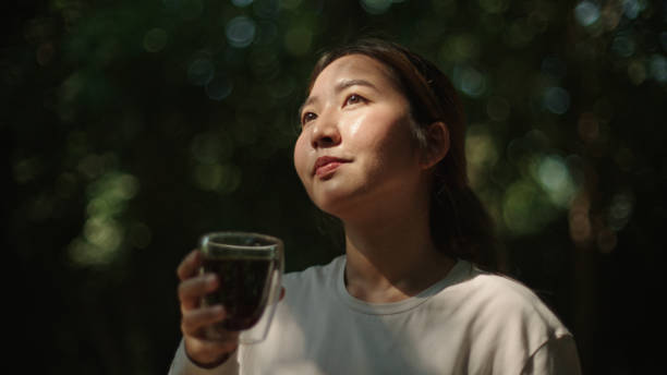 istock Woman drinking coffee at nature. 2185568897