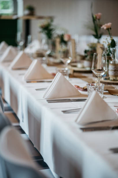 istock Rustic Wedding Table Setting with Vintage Glass Bottles, Wood Slices and napkins 2185569247