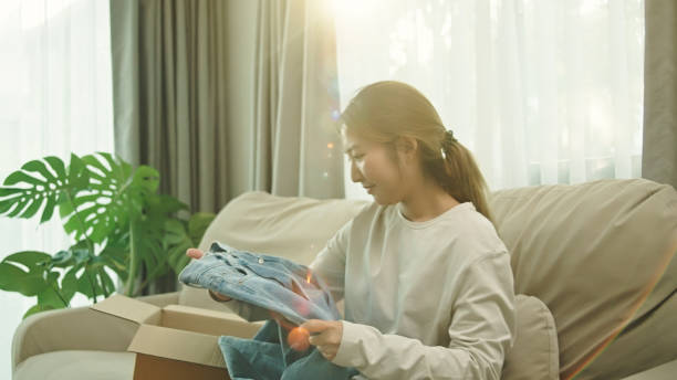 istock Woman checking jeans from online shopping. 2185570377